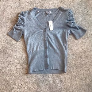 Color is gray with black buttons.